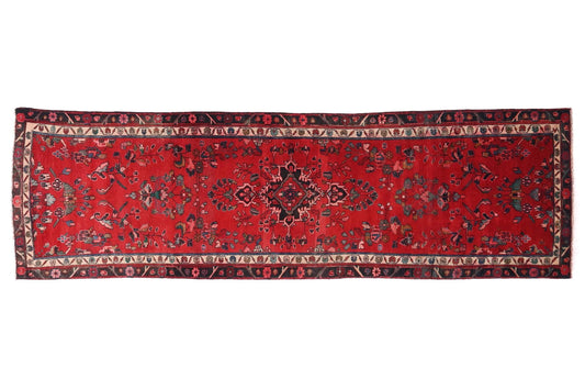Red patterned rug on a white background