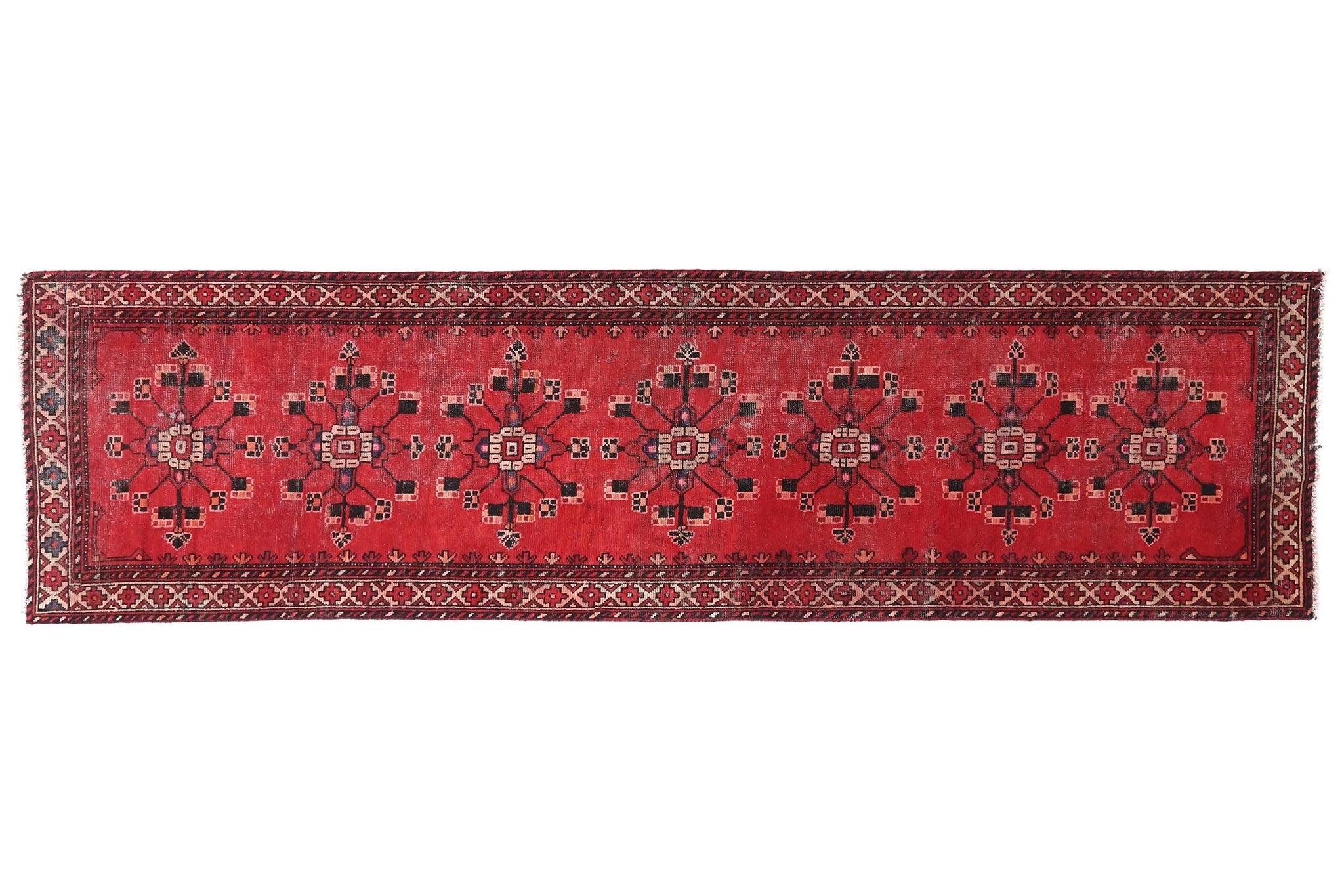 Red patterned rug on a white background