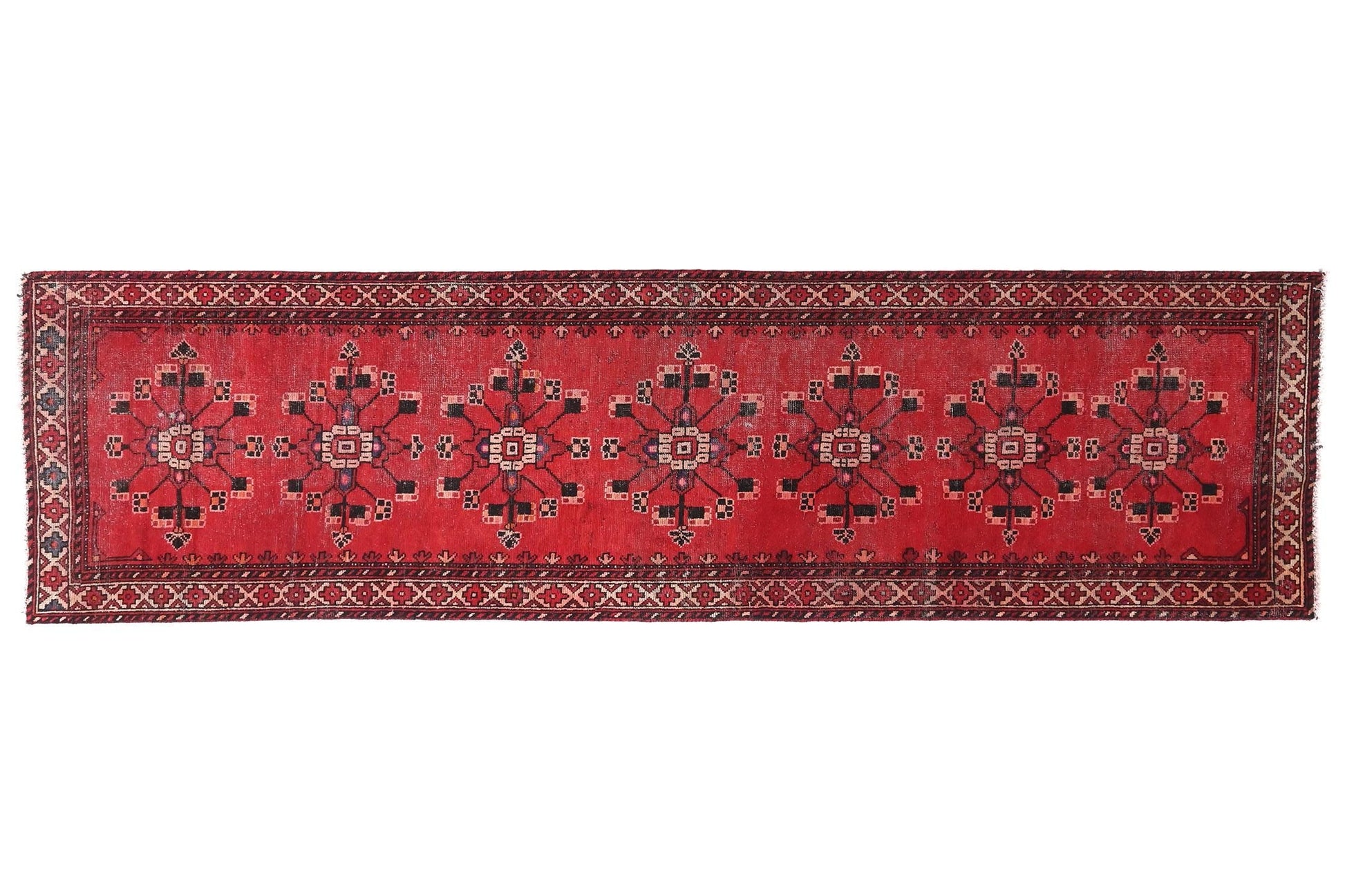 Red patterned rug on a white background