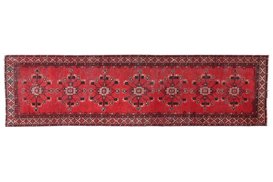 Red patterned rug on a white background