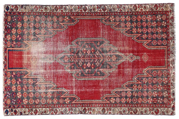 Red patterned rug on a white background