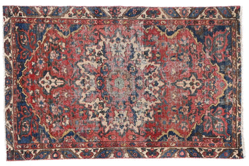 Vintage-patterned rug with intricate design on a white background