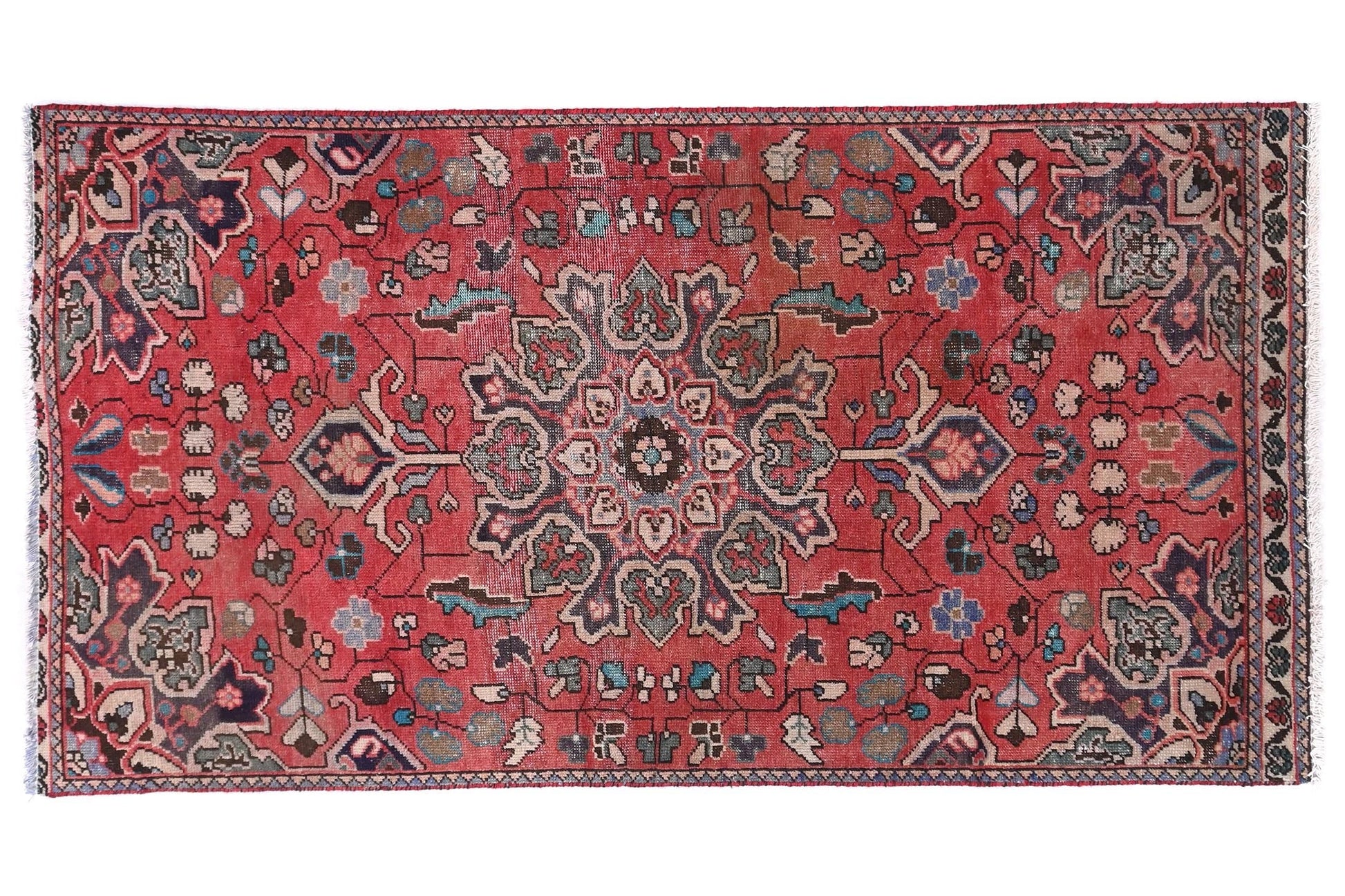 Decorative rug with intricate patterns on a white background