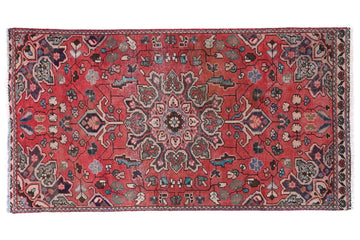 Decorative rug with intricate patterns on a white background