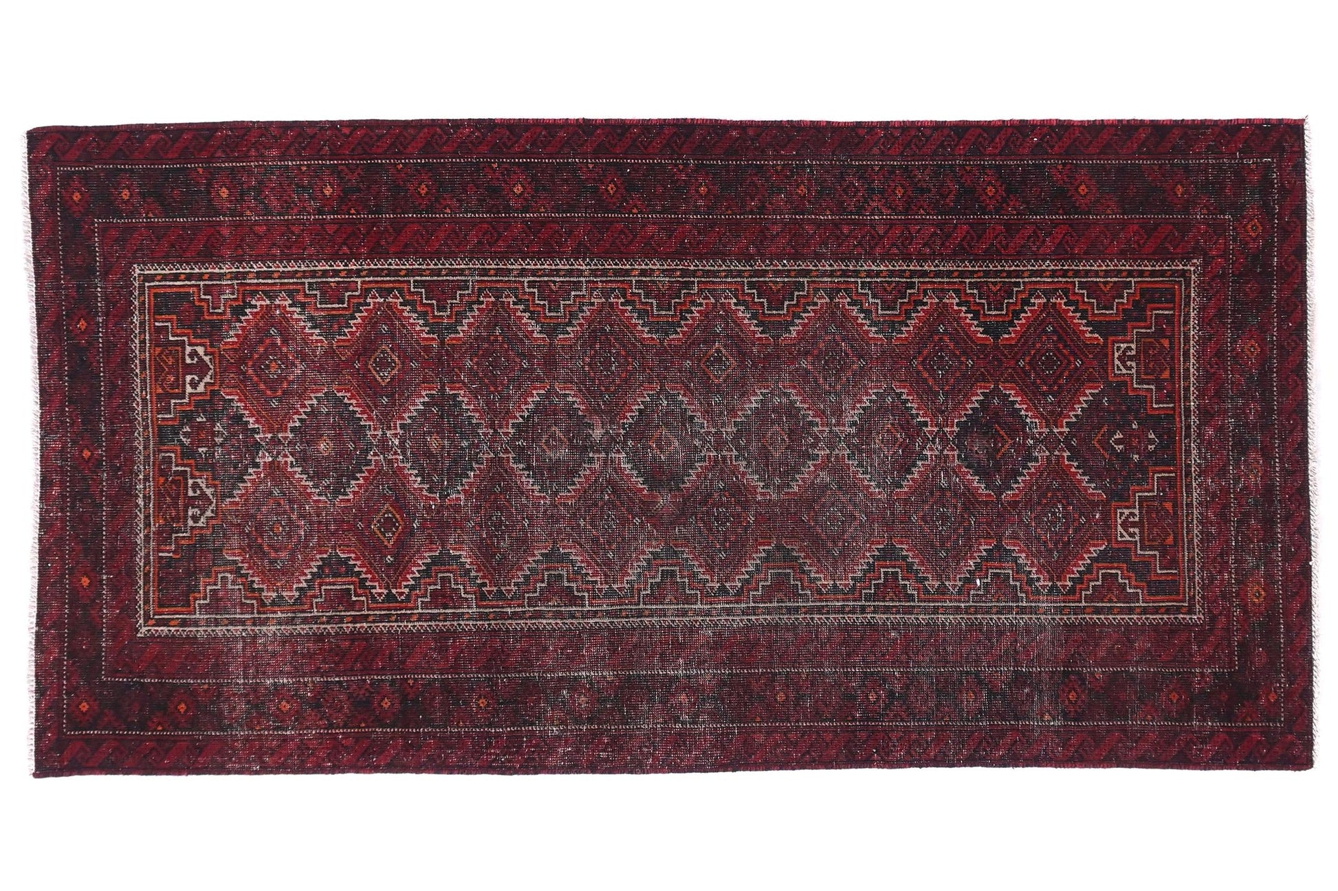 Red patterned rug on a white background