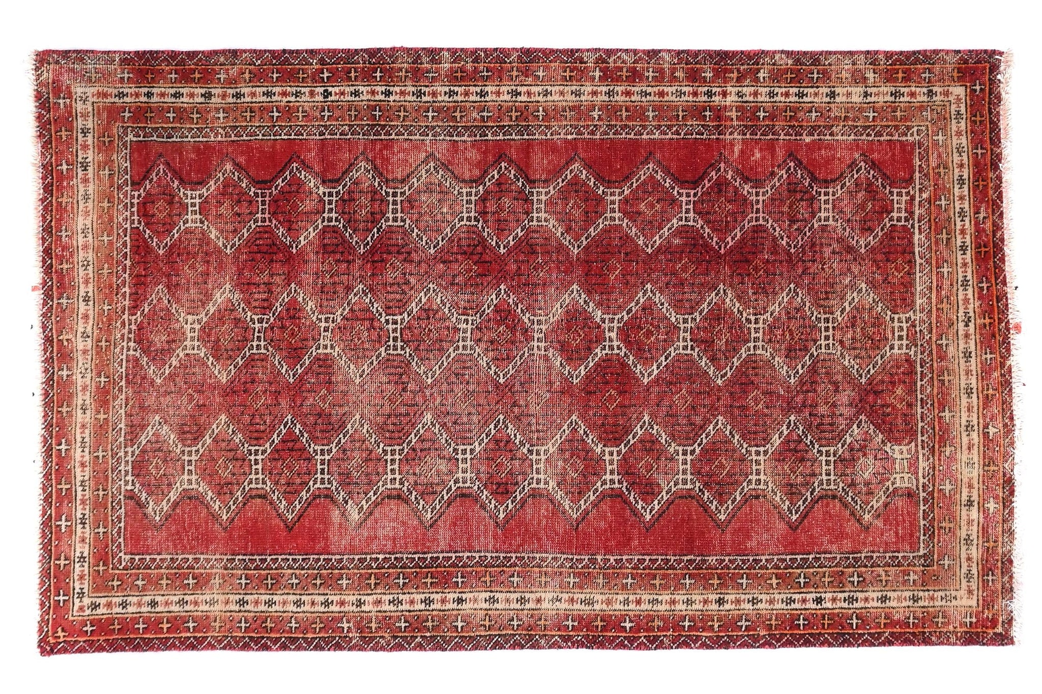 Red patterned rug on a white background