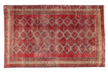 Red patterned rug on a white background