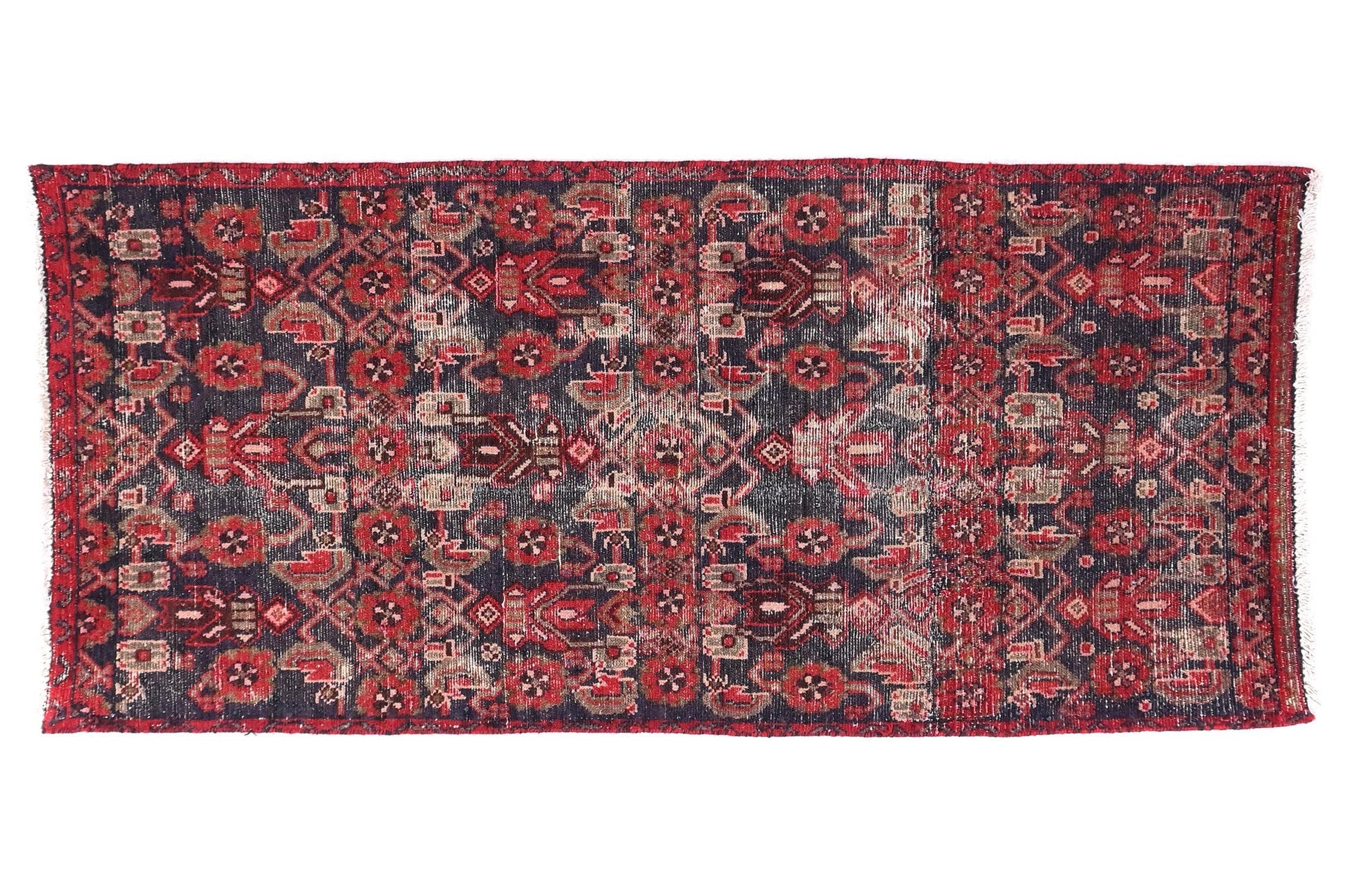 Decorative rug with intricate patterns on a white background