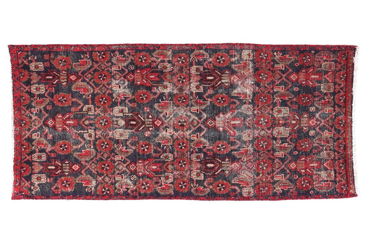 Decorative rug with intricate patterns on a white background