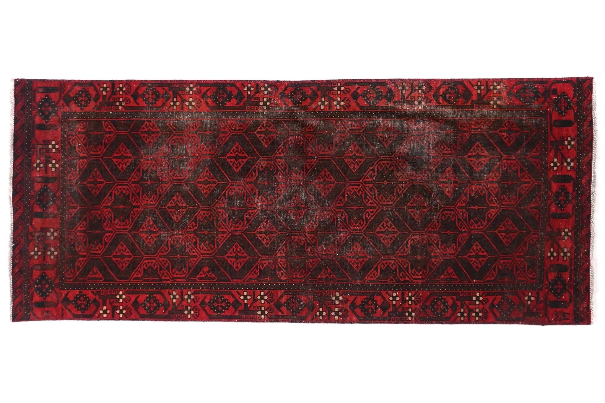 Red patterned rug on a white background