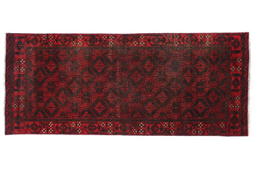 Red patterned rug on a white background