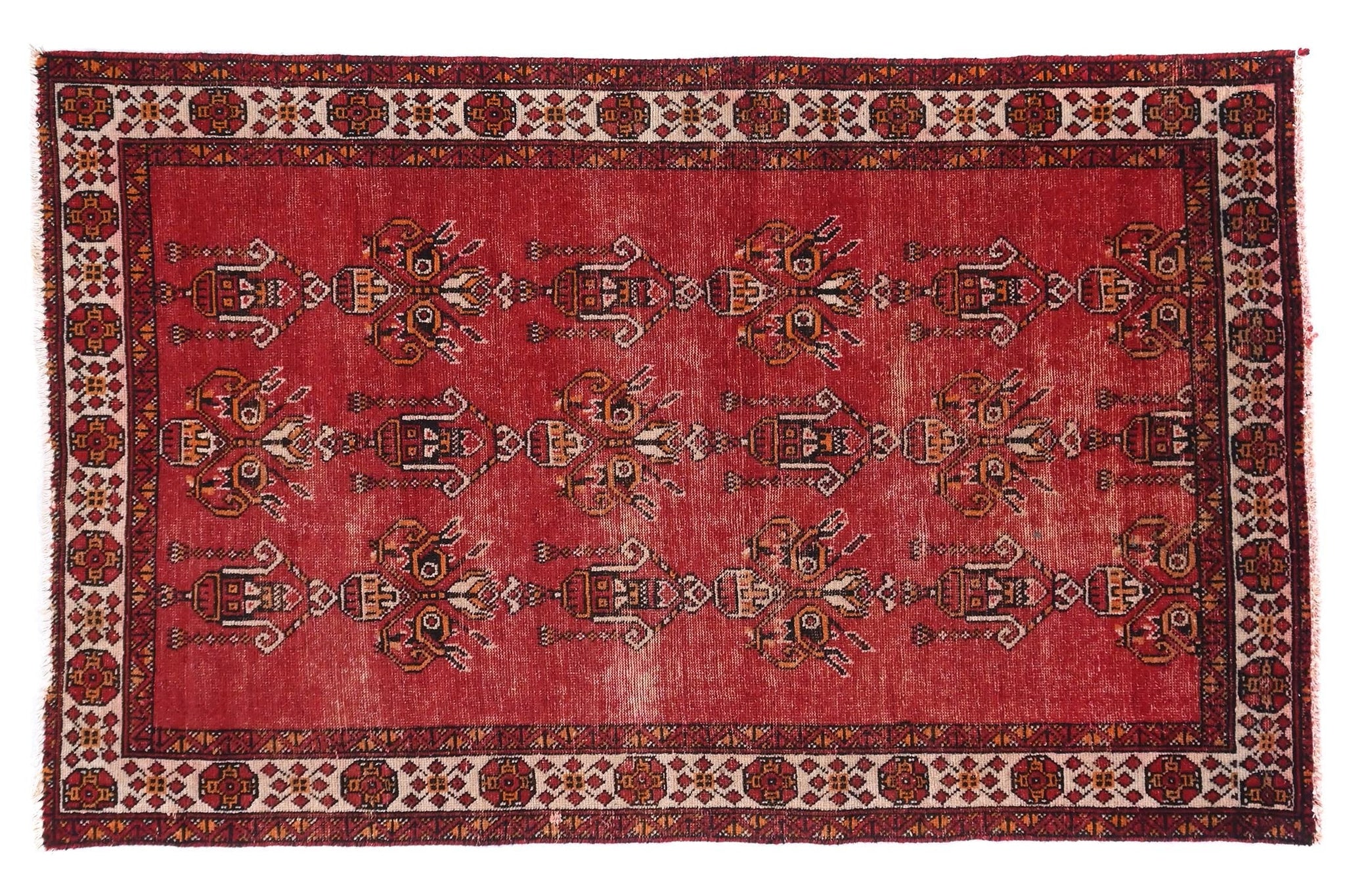 Red patterned rug on a white background