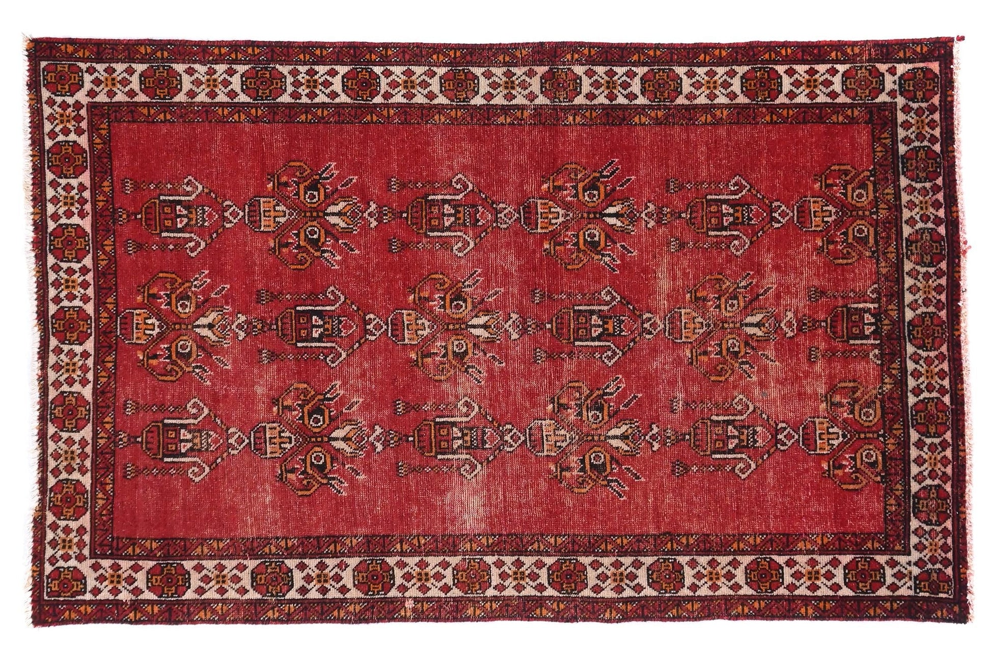 Red patterned rug on a white background