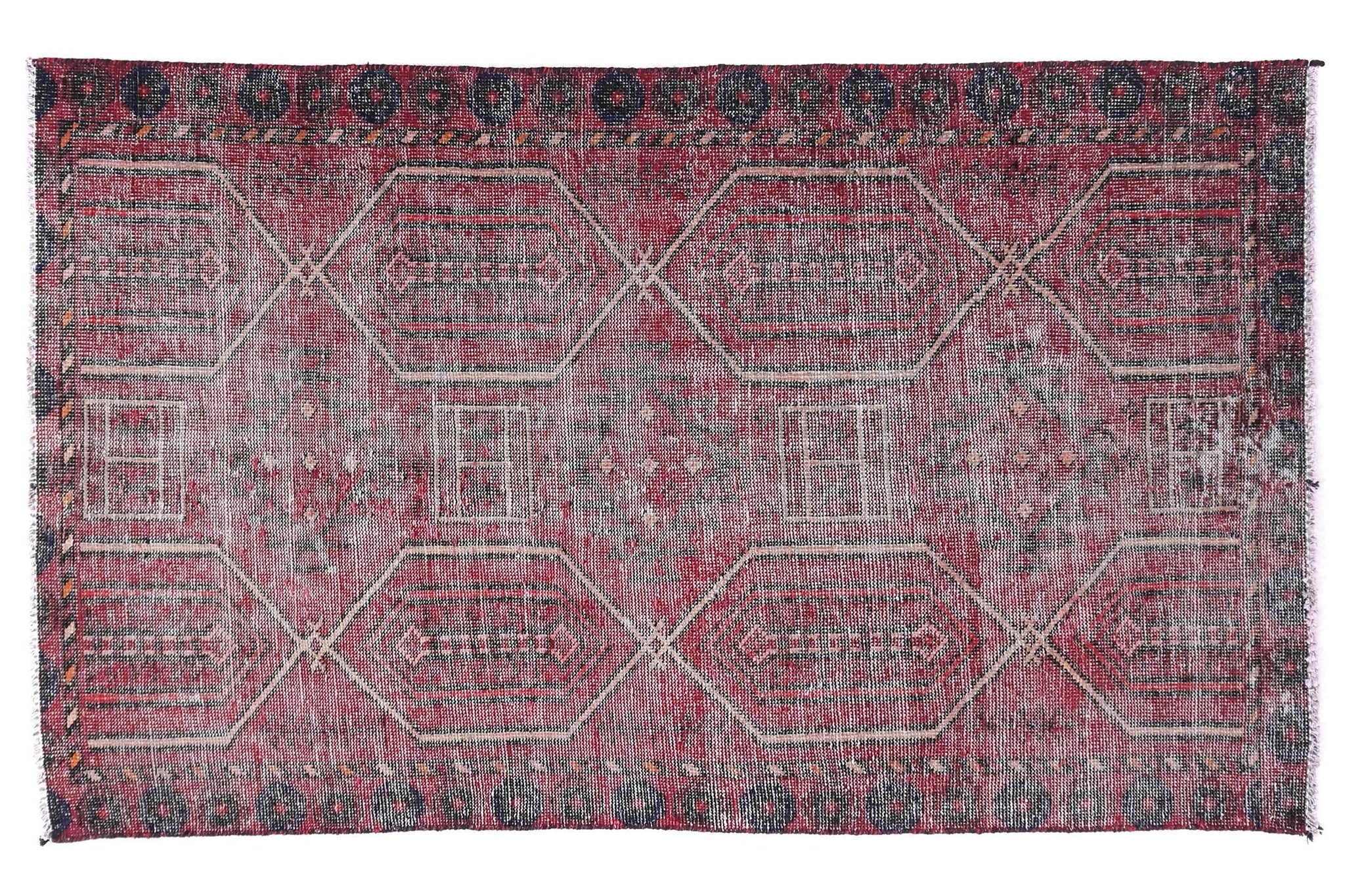Red and gray patterned rug on a white background