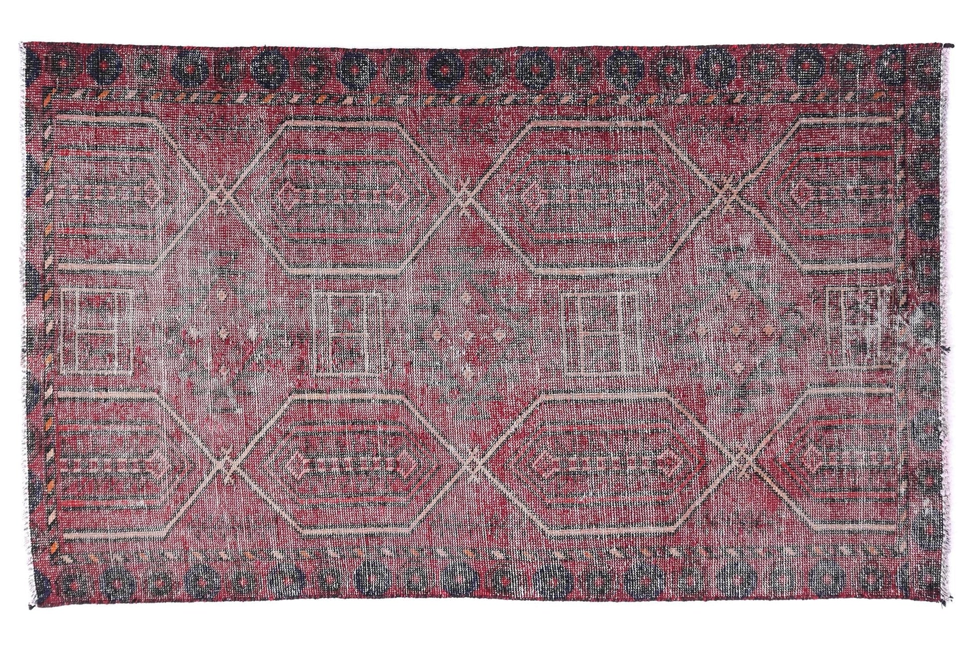 Red and gray patterned rug on a white background