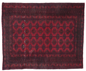 Red and black patterned rug on a white background
