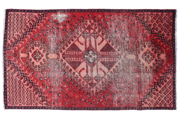 Red patterned rug on a white background