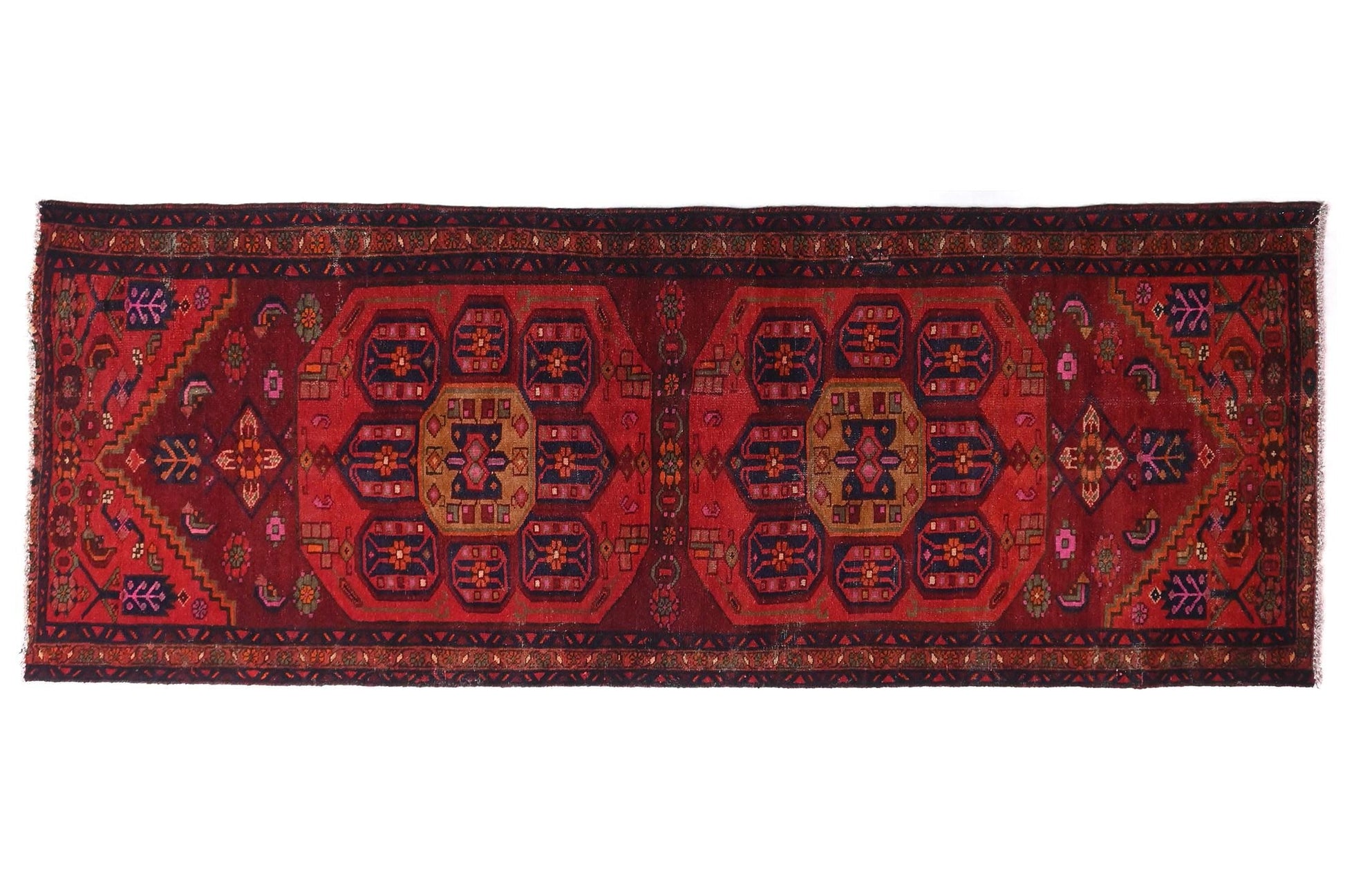 Red patterned rug on a white background