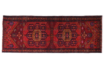 Red patterned rug on a white background