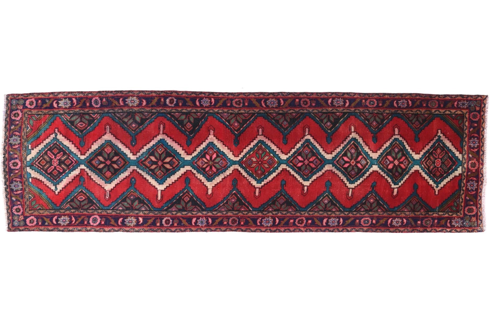 Red and black patterned rug on a white background