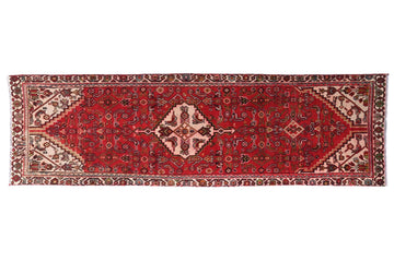 Red patterned rug on a white background