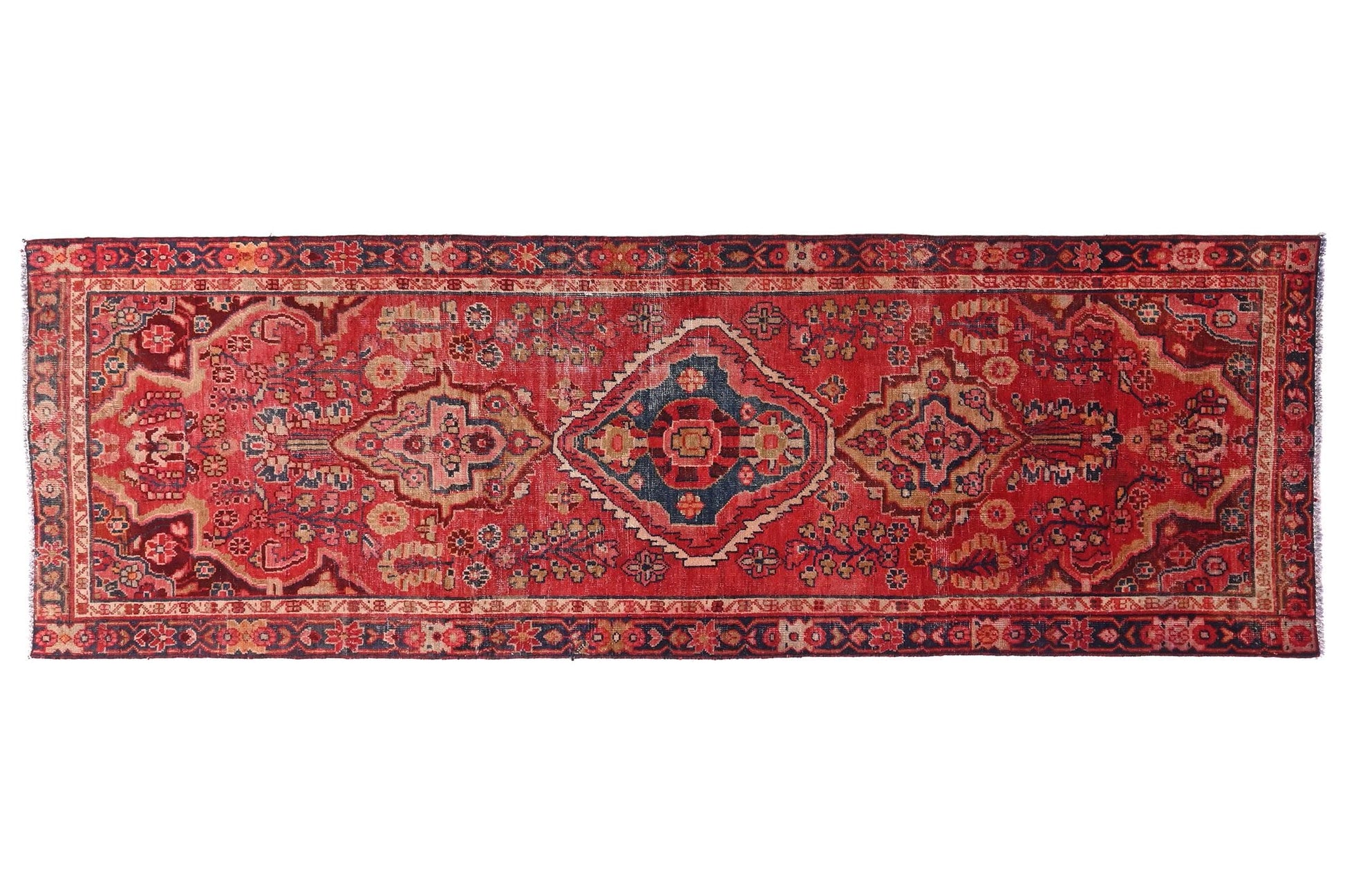 Red patterned rug on a white background