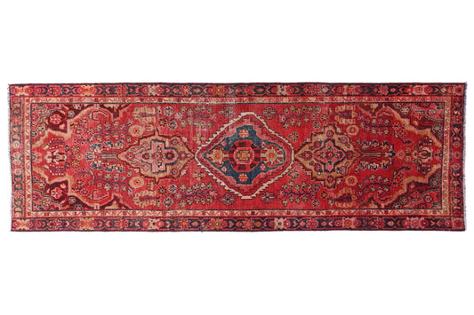 Red patterned rug on a white background