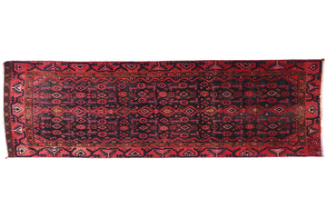 Red patterned rug on a white background