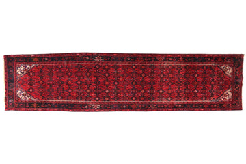 Red patterned rug on a white background