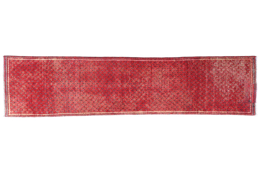 Red runner rug on a white background